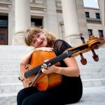 Laura Raymond holding a cello